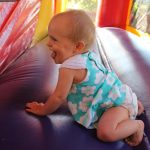 baby in a bounce house