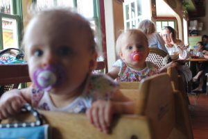 twin babies in a restaurant rockin baja oceanside