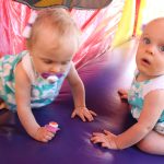 Twin Babies in a Bounce House