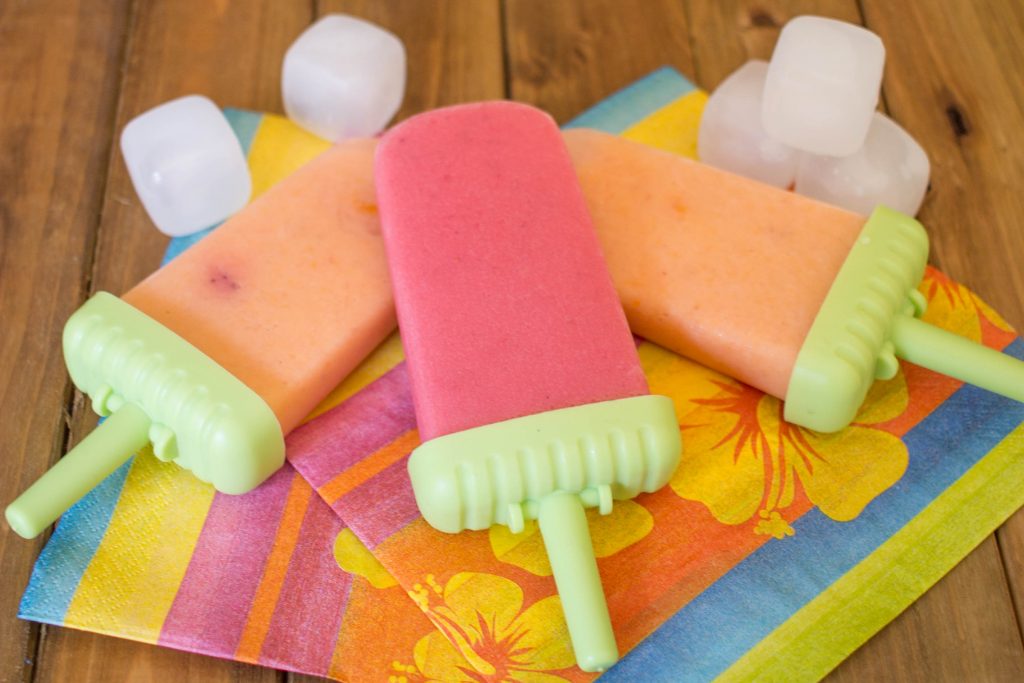 One of my favorite healthy kids recipes for easy homemade fruit popsicles. Fun ice pops can be low sugar by using greek yogurt, fresh fruit and honey. These are great summer treats that are also a healthy snack!